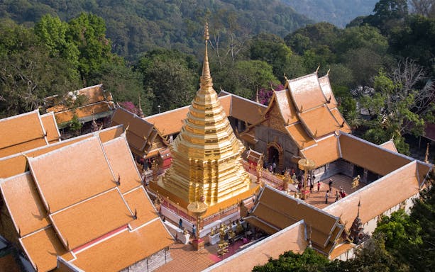 Golden stupa of Wat Phra That Doi Suthep surrounded by temple buildings in Chiang Mai, Thailand.