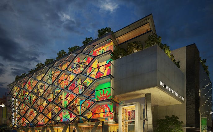 Indian Heritage Centre facade with vibrant mural and modern architecture at dusk.