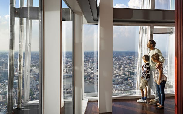 Family enjoying view from The Shard, overlooking London landmarks, included in Go City: London Explorer Pass.