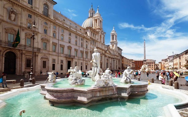 Piazza Navona with Fountain of Neptune in Rome during a guided tour.