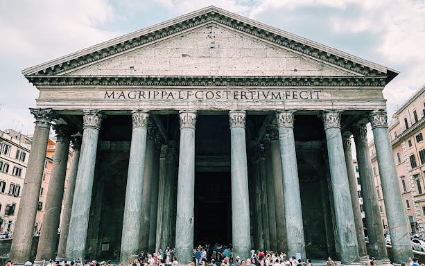 Pantheon in Rome with tourists gathered at the entrance.