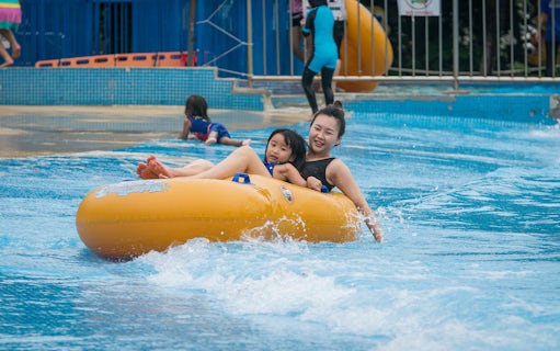 Family enjoying water ride at Water World, i-City Shah Alam.