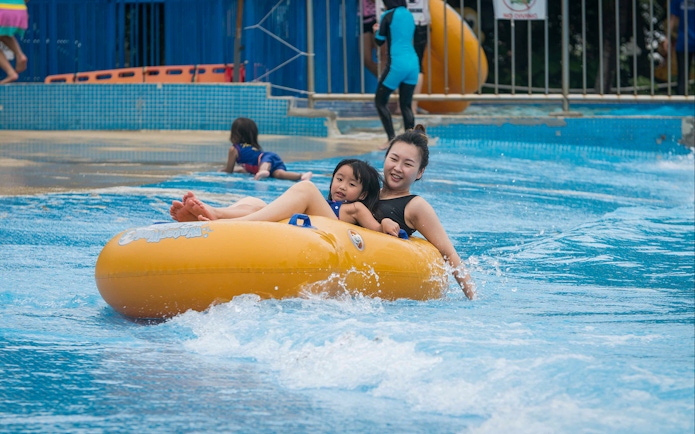 Family enjoying water ride at Water World, i-City Shah Alam.