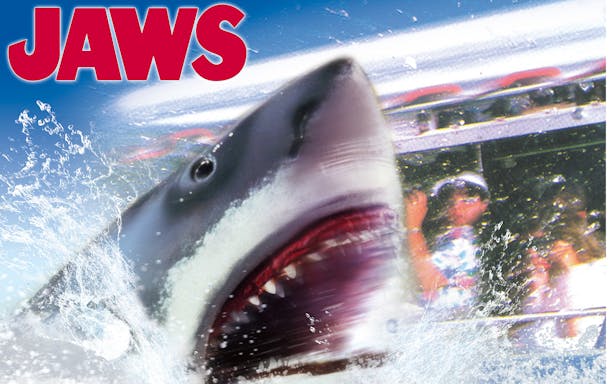 Shark emerging from water near boat at Universal Studios Japan.