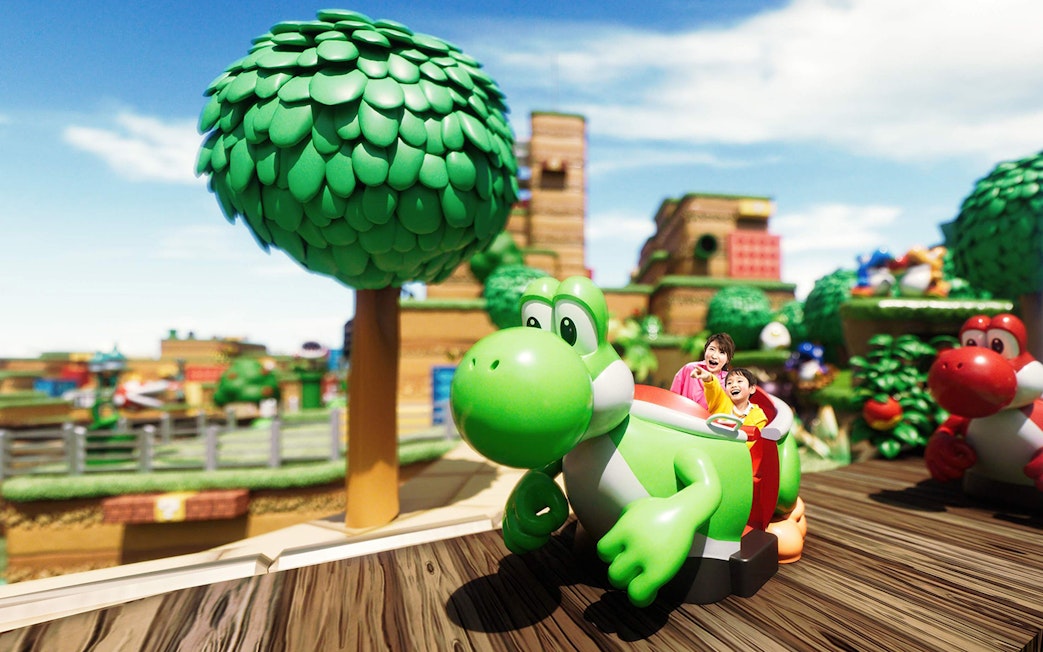 Visitors enjoying a Yoshi ride at Universal Studios Japan.