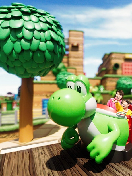 Visitors enjoying a Yoshi ride at Universal Studios Japan.