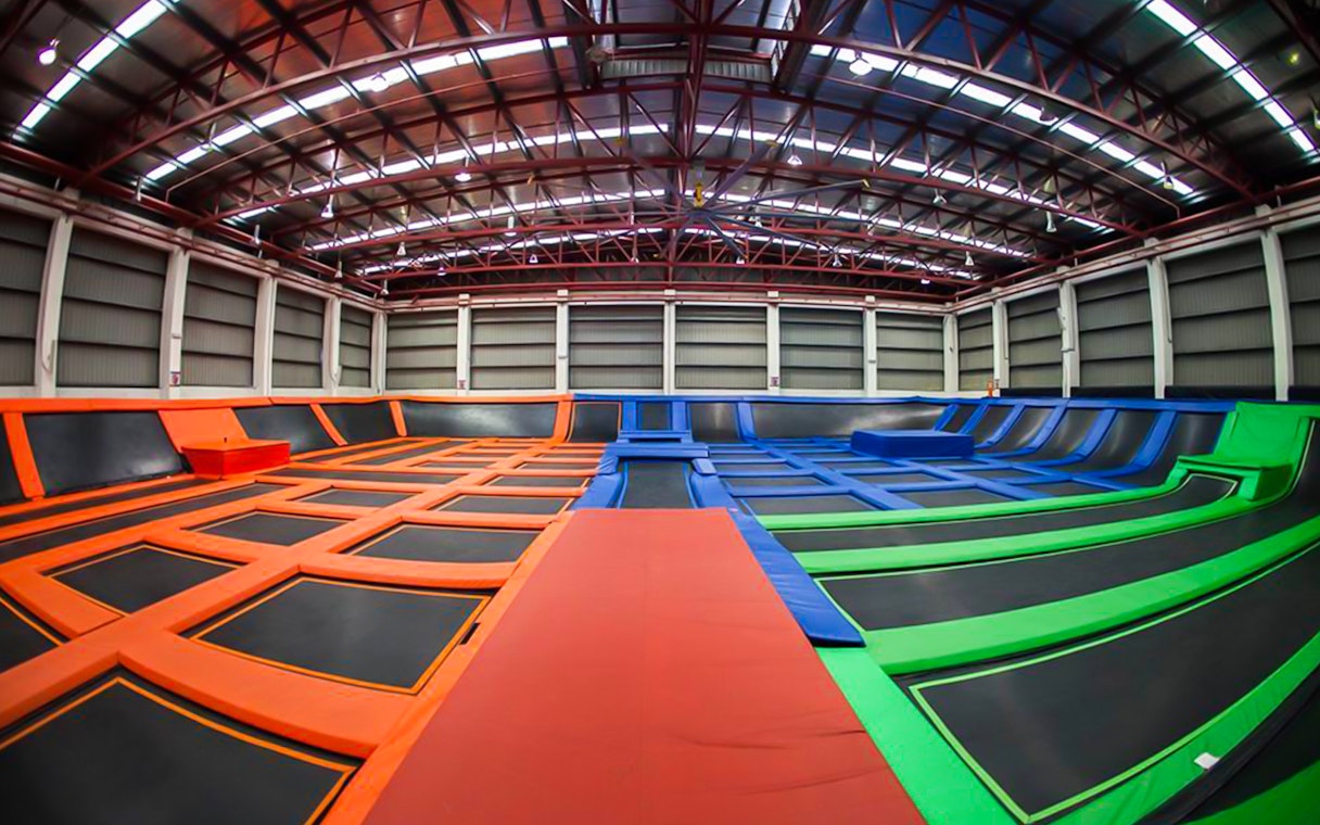 Indoor trampoline park with colorful trampolines at Jump Street Asia, Kuala Lumpur.