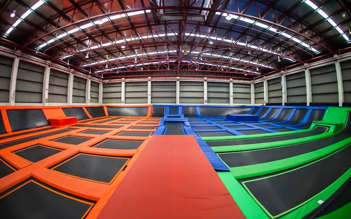 Indoor trampoline park with colorful trampolines at Jump Street Asia, Kuala Lumpur.