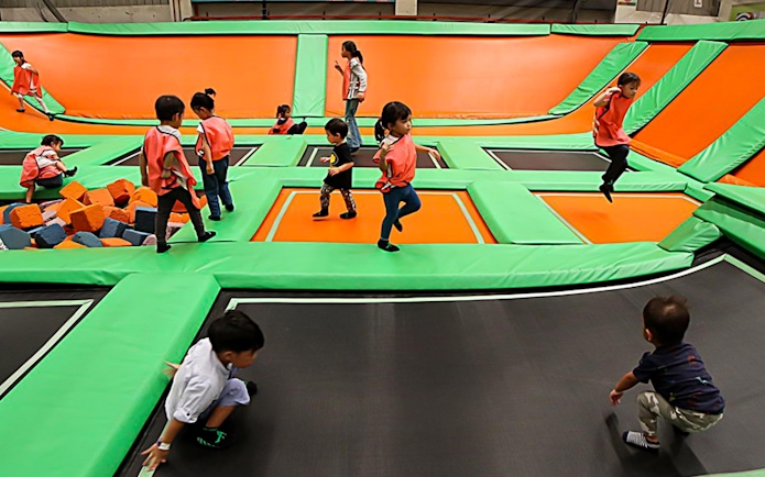 Children playing on trampolines at Jump Street Asia in Kuala Lumpur.
