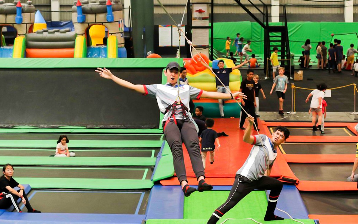 Children playing on trampolines at Jump Street Asia in Kuala Lumpur.