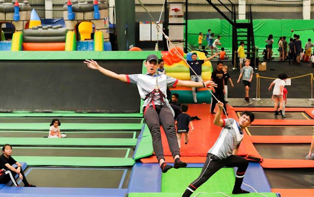 Children playing on trampolines at Jump Street Asia in Kuala Lumpur.