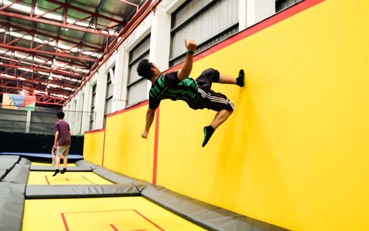 Person jumping on trampolines at Jump Street Asia, Kuala Lumpur.