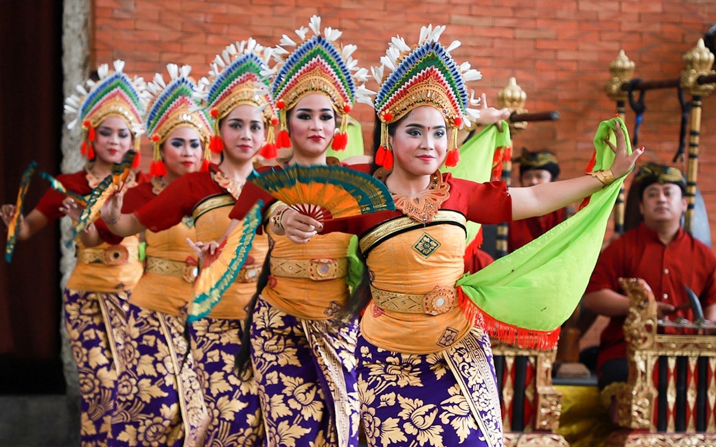 Balinese dancers performing at Garuda Wisnu Kencana Culture Park in Bali.
