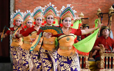 Balinese dancers performing at Garuda Wisnu Kencana Culture Park in Bali.