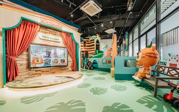 Kiztopia Club Punggol indoor playground with colorful slides and cartoon characters.