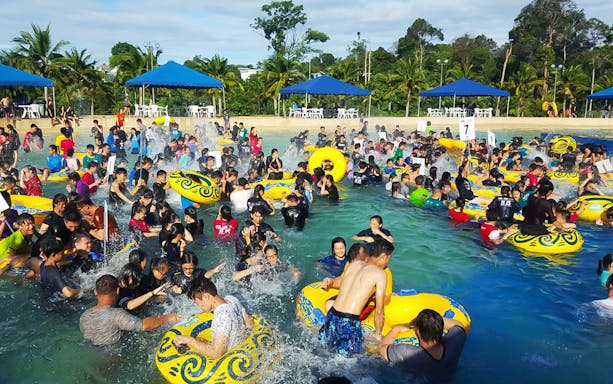 Crowd enjoying the wave pool at Melaka Wonderland Water Theme Park.