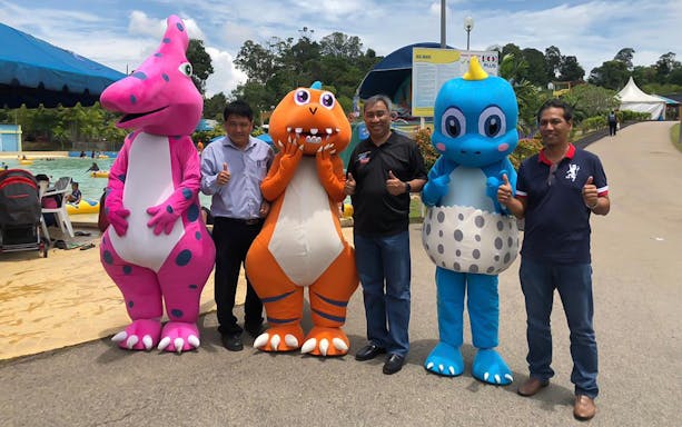 Costumed characters and visitors at Melaka Wonderland Water Theme Park.