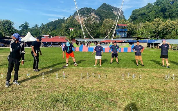 Participants engaging in a team-building activity at Langkawi Adventure & Xtreme Park.