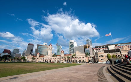 Sultan Abdul Samad Building with Kuala Lumpur skyline in the background.