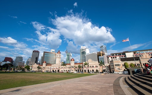 Sultan Abdul Samad Building with Kuala Lumpur skyline in the background.