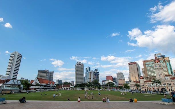 Kuala Lumpur cityscape with Sultan Abdul Samad Building and skyline during half-day city tour.