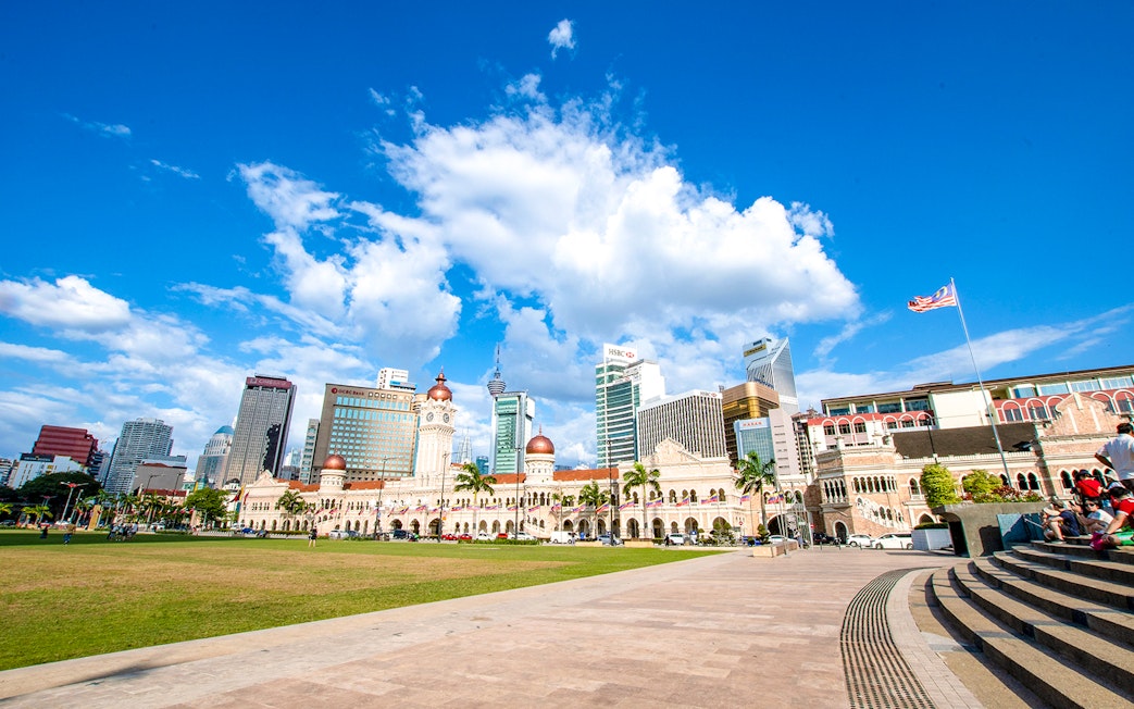 Sultan Abdul Samad Building with Kuala Lumpur skyline on guided tour.