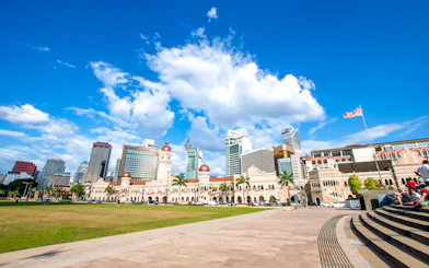 Sultan Abdul Samad Building with Kuala Lumpur skyline on guided tour.