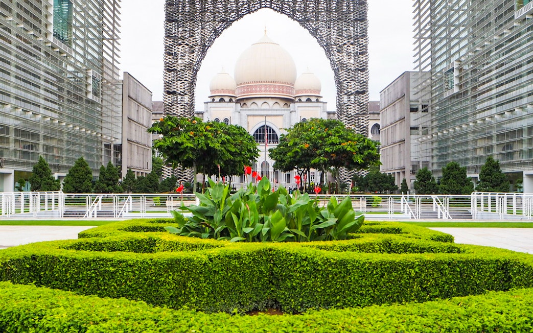 Kuala Lumpur architecture with lush gardens on a guided tour.