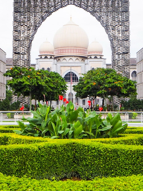 Kuala Lumpur architecture with lush gardens on a guided tour.