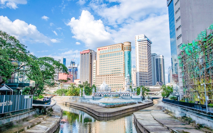 Kuala Lumpur skyline with Jamek Mosque by the river.
