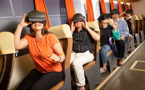 Visitors wearing VR headsets on the Berlin TimeRide VR time travel experience.