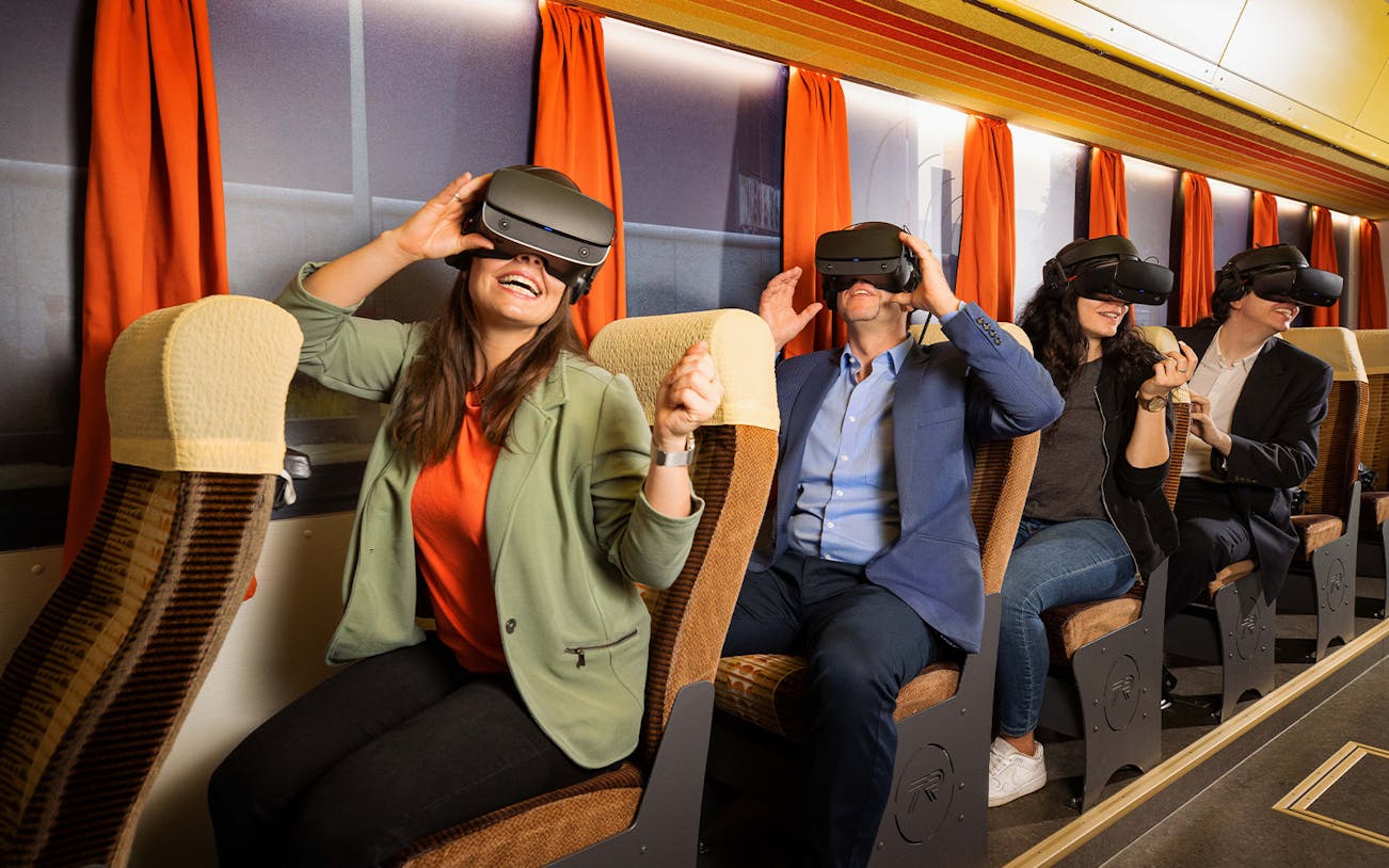 Visitors enjoying VR headsets on the Berlin TimeRide time travel experience.