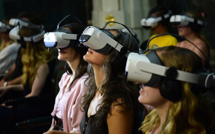 Visitors experiencing Schönbrunn Palace virtual tour with VR headsets.