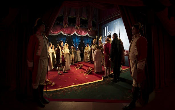 Ceremonial reenactment at Schönbrunn Palace with historical figures in period attire.