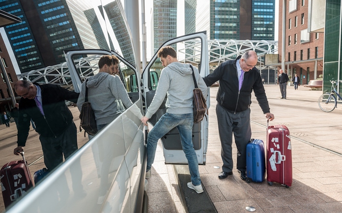 Passengers entering a van with luggage for private airport transfer at KLIA/KLIA2.