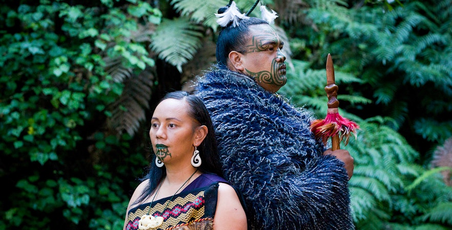Traditional Maori performers in cultural attire at Mitai Maori Village, Rotorua, New Zealand
