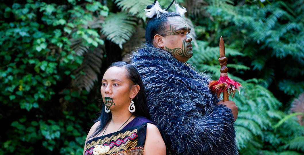 Traditional Maori performers in cultural attire at Mitai Maori Village, Rotorua, New Zealand