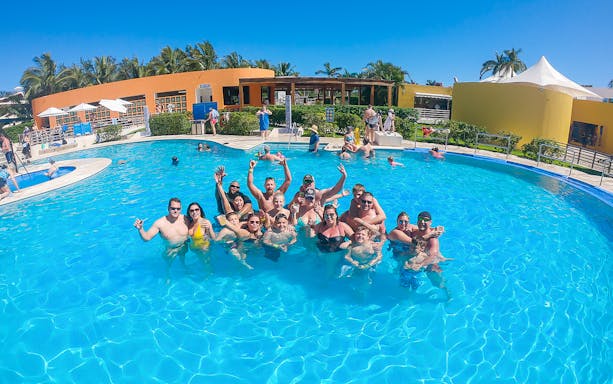 Group enjoying the pool at Playa Mia Grand Beach Park, Cozumel.