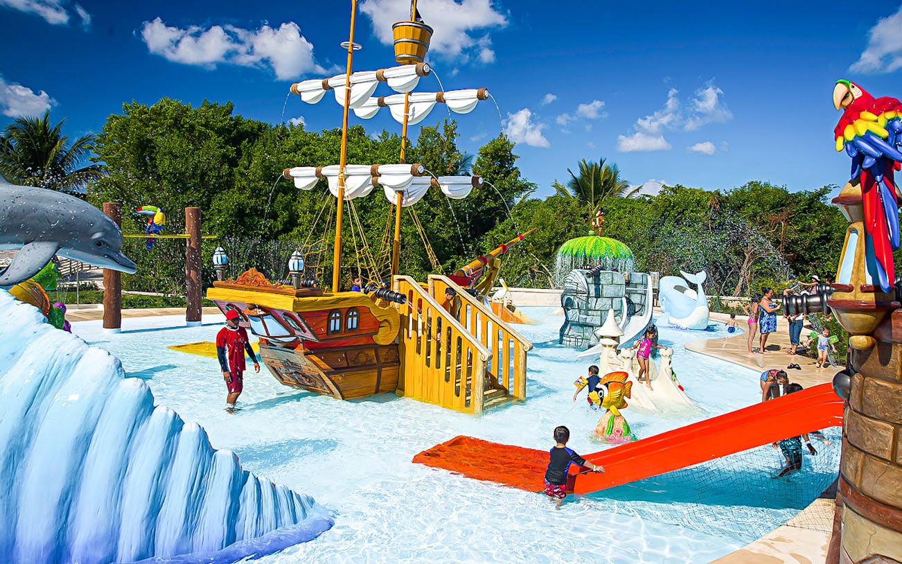 Children playing at the pirate-themed water park in Playa Mia Grand Beach Park.