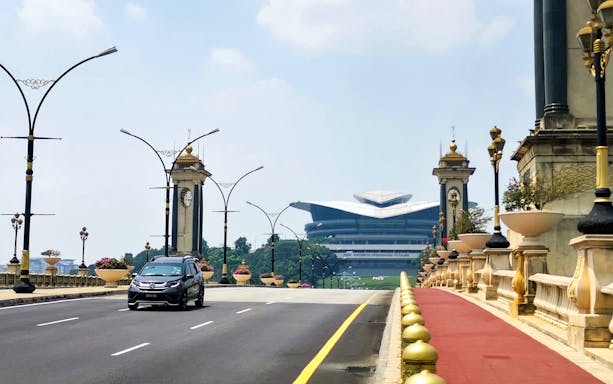 Putrajaya bridge view with modern architecture in the background, Malaysia.
