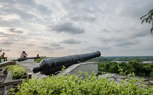 Historic cannon overlooking Kuala Selangor landscape during fireflies night tour.