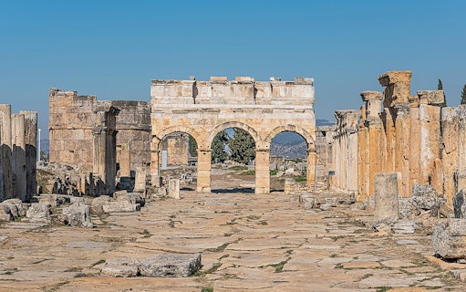 Ancient stone archway and ruins in Hierapolis, Pamukkale, Turkey.