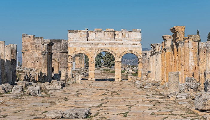 Pamukkale travertine terraces with tourists exploring, part of Antalya/Kemer tour.
