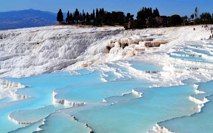Pamukkale's travertine terraces with turquoise pools in Turkey.