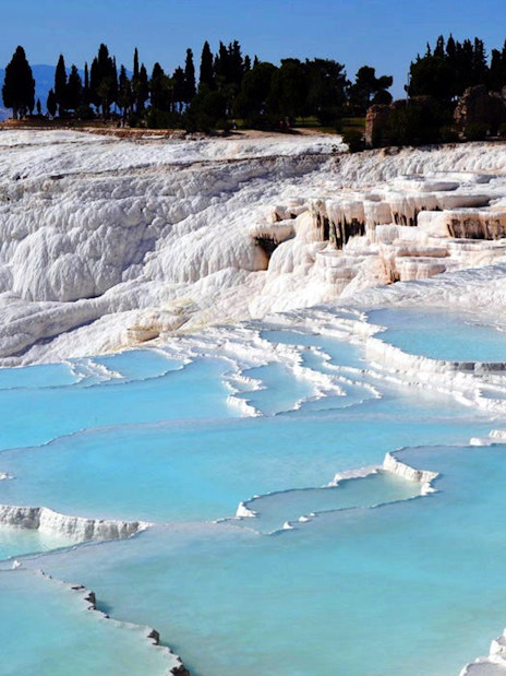 Pamukkale's travertine terraces with turquoise pools in Turkey.