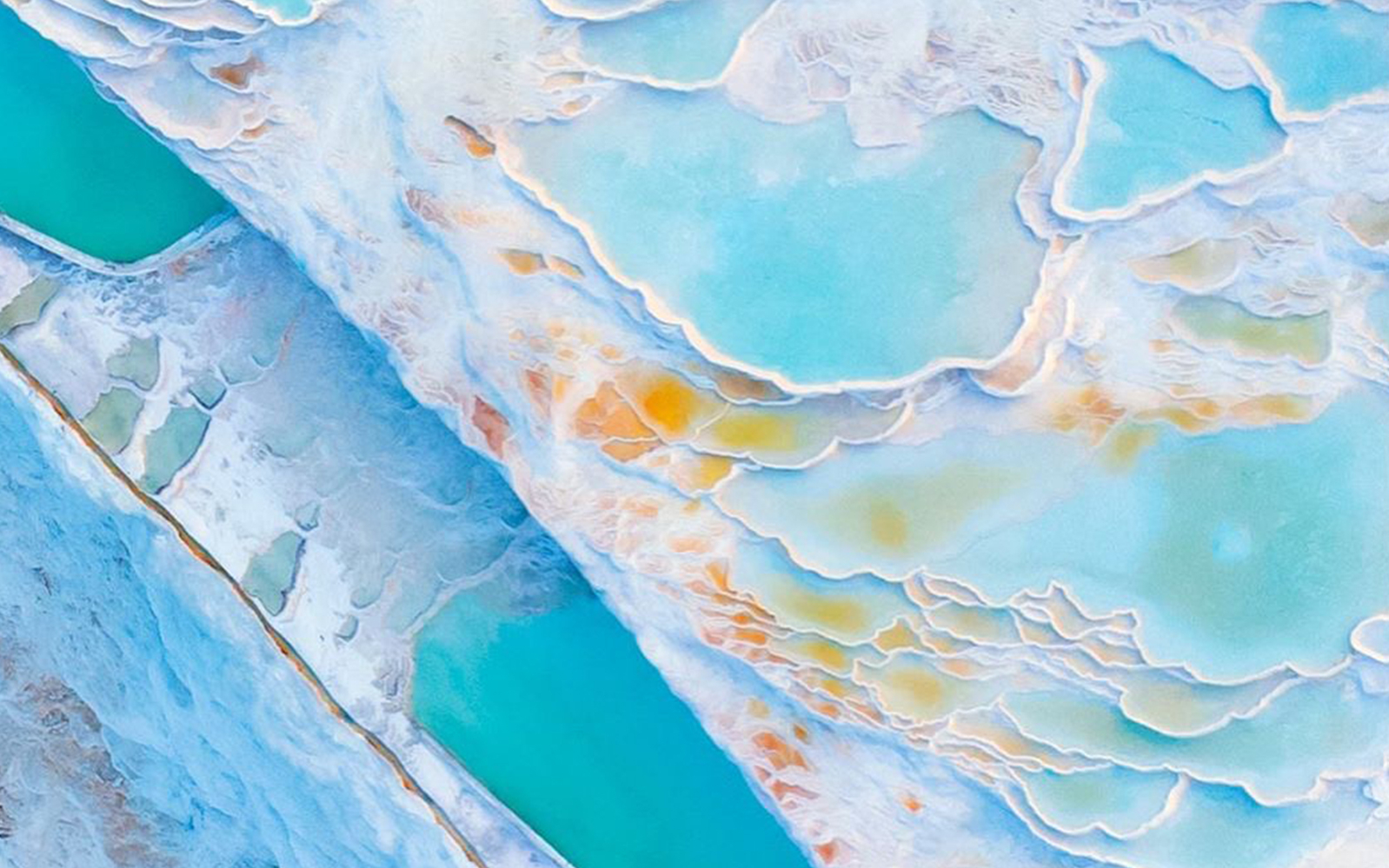 Pamukkale thermal terraces with turquoise pools in Turkey.