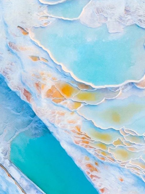 Pamukkale thermal terraces with turquoise pools in Turkey.