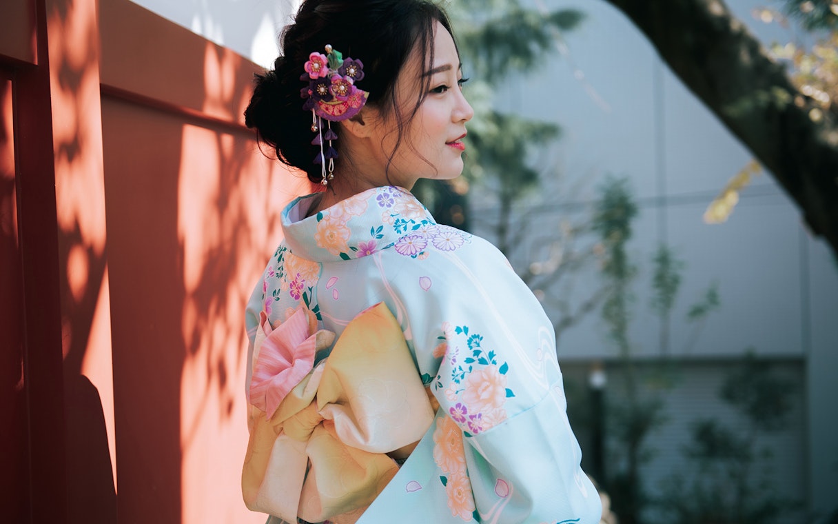 Person wearing a floral kimono in Tokyo.