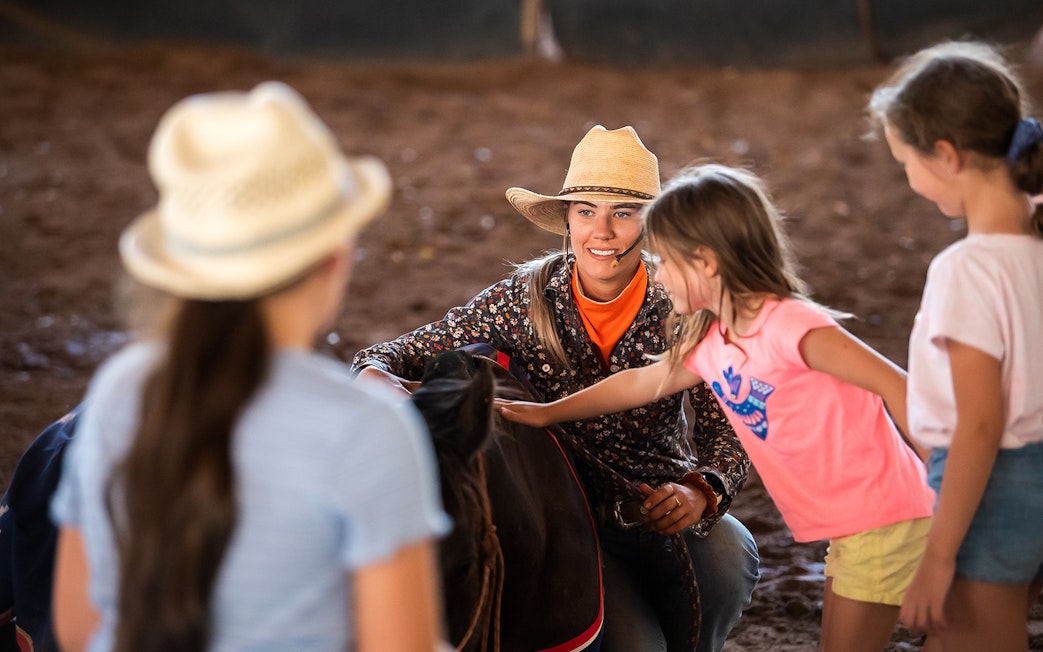 Children interacting with a performer at Katherine Outback Experience show.