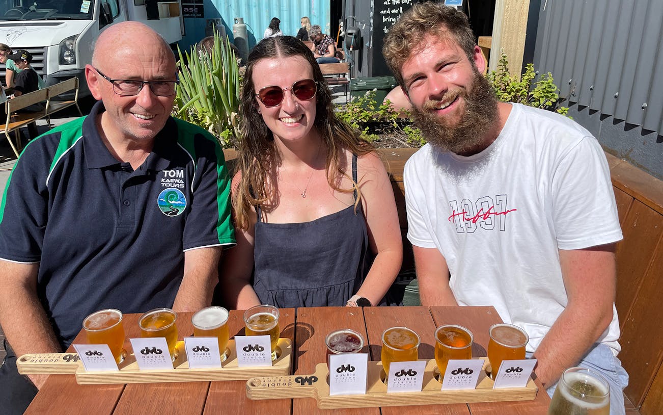 Group enjoying craft beer tasting on Foodie Delights Private Tour in Wellington.